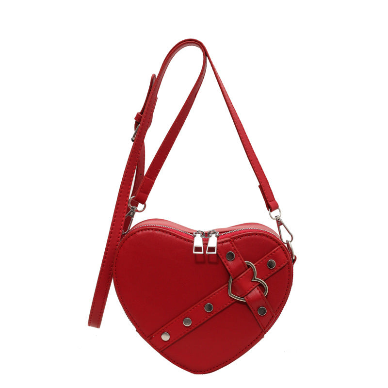 Modische Umhängetasche für Damen ⎜ Herzförmige Crossbody-Tasche im auffälligen Design mit Riemenverschluss