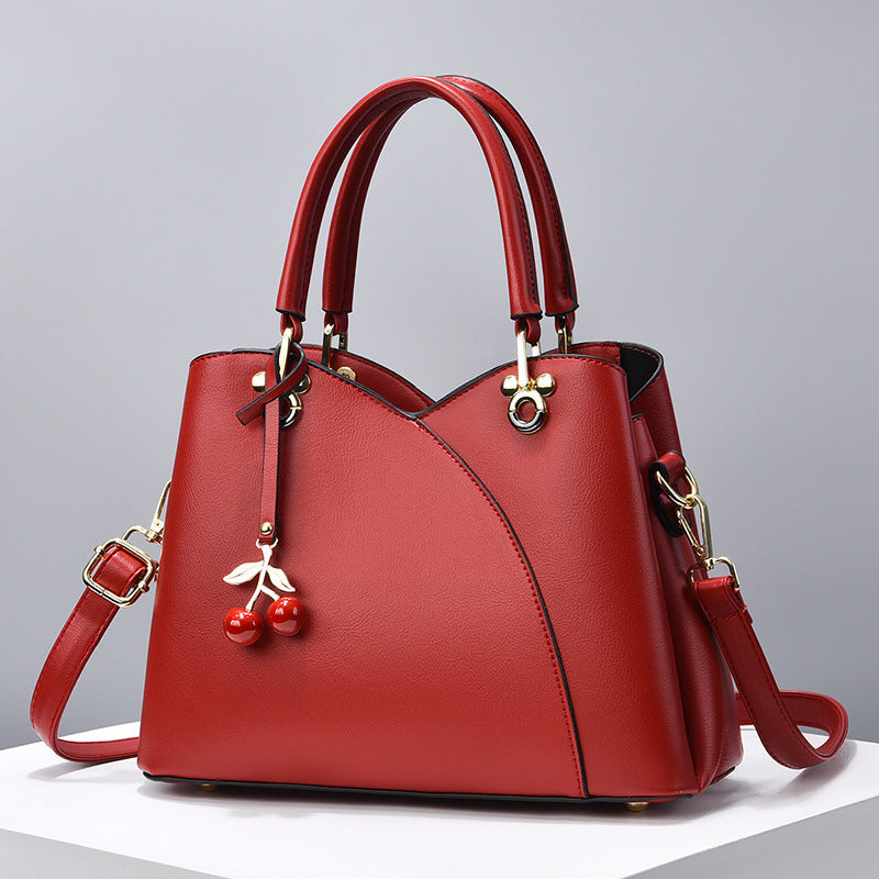 Elegante Handtasche für Damen ⎜ Modische Umhängetasche mit Kirschenanhänger