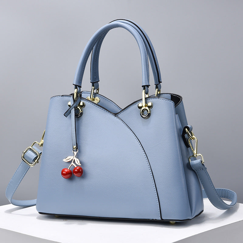 Elegante Handtasche für Damen ⎜ Modische Umhängetasche mit Kirschenanhänger