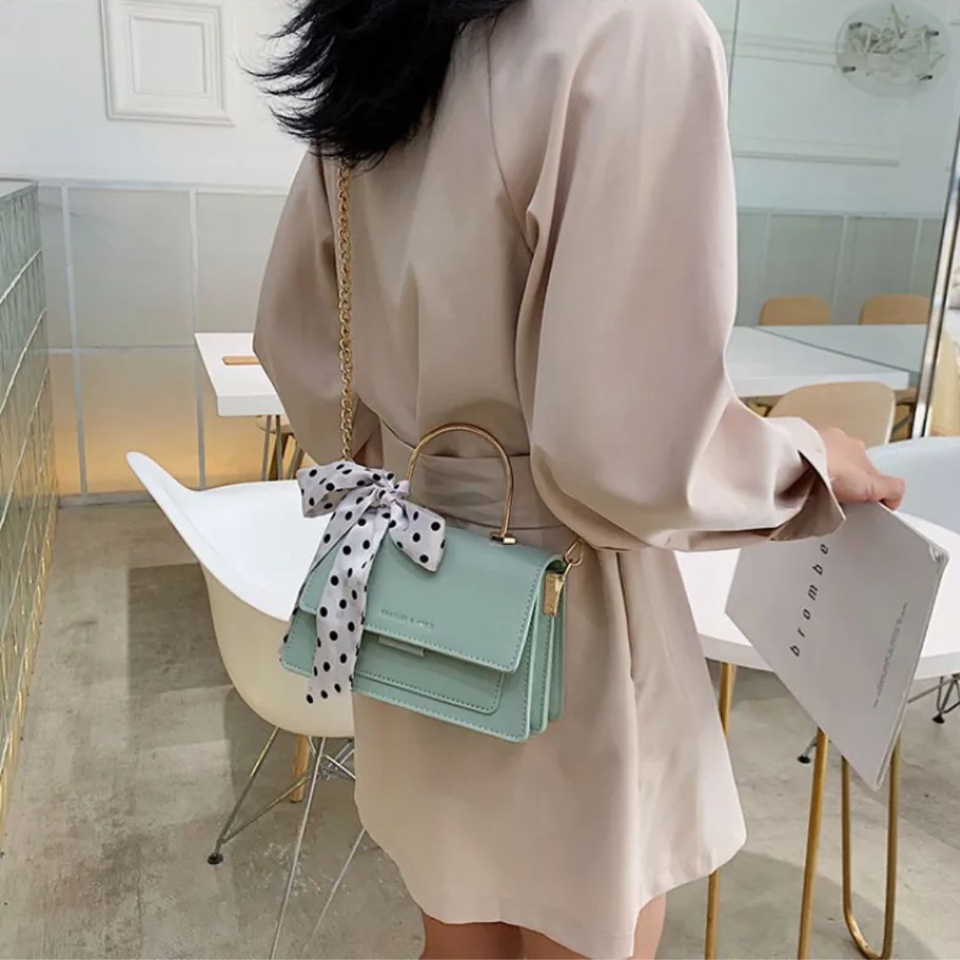 Umhängetasche für Damen ⎜ Modische Tasche mit Polka-Dots Schleife und Kettenriemen