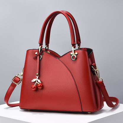 Elegante Handtasche für Damen ⎜ Modische Umhängetasche mit Kirschenanhänger